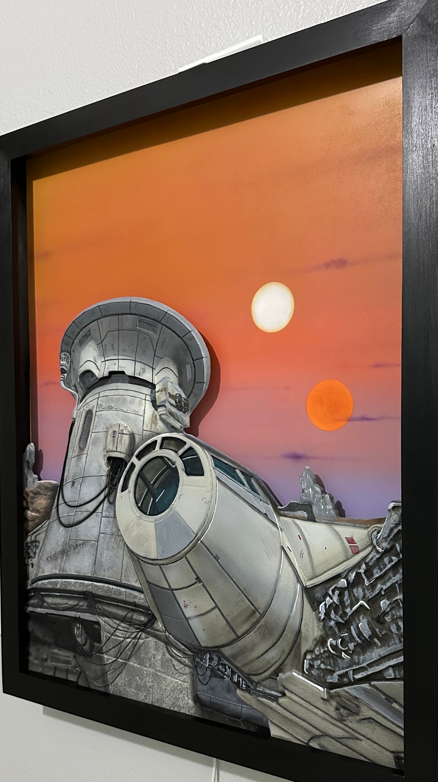 1. “Twin Suns Departure” – Limited Edition Illuminated Art Panel
Mixed Media | Backlit Canvas | Framed in Midnight Black Hardwood. Artist: Nick Valencia