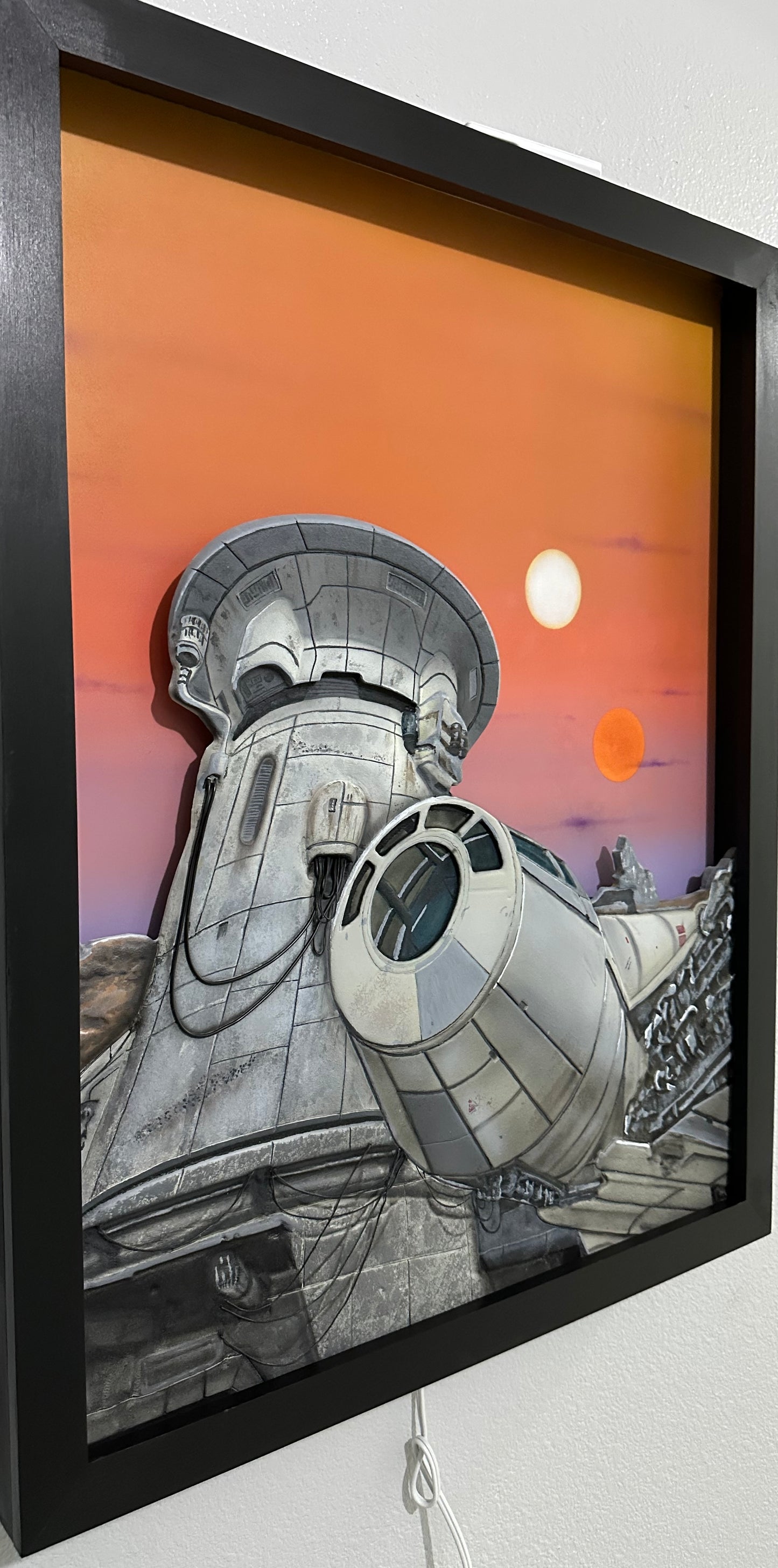 1. “Twin Suns Departure” – Limited Edition Illuminated Art Panel
Mixed Media | Backlit Canvas | Framed in Midnight Black Hardwood. Artist: Nick Valencia